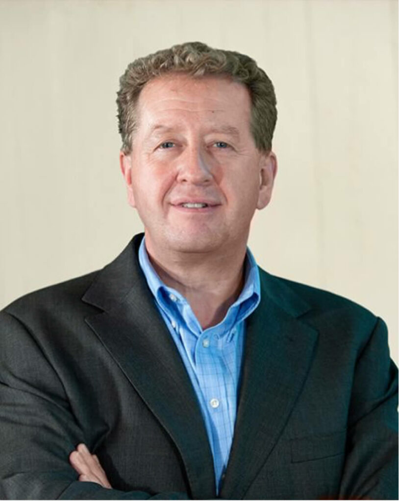 Main in suit.